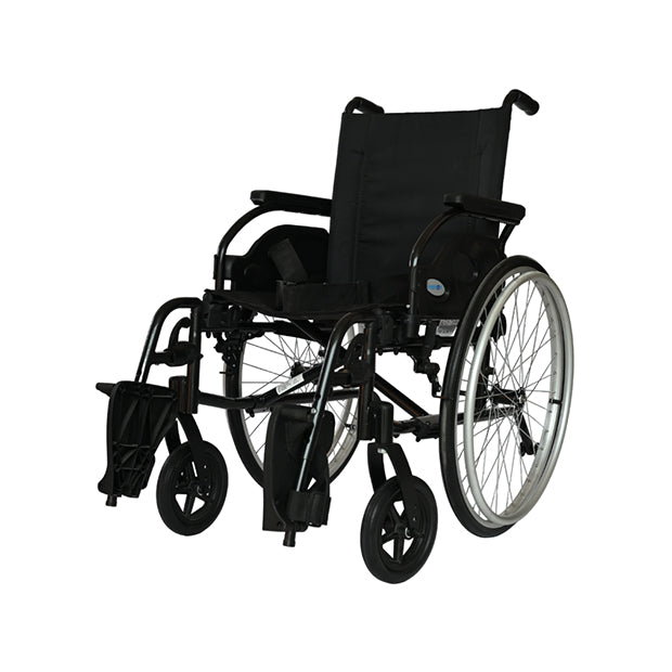 Forza Freedom 5000 STD Premium Steel Wheelchair. The wheelchair features a durable steel frame in a dark gray finish with a comfortable black seat and backrest. It has large, solid rear wheels with hand rims for easy self-propulsion, and smaller front casters for smooth maneuverability. The wheelchair is designed with fixed armrests, footrests, and a foldable frame for easy storage and transport, combining strength and practicality for everyday use.